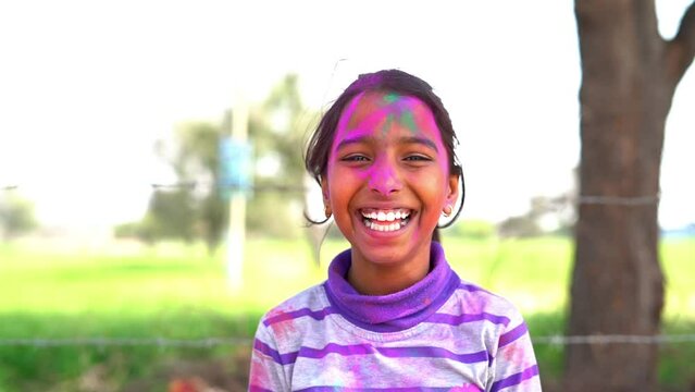 Cheerful young kids celebrating Holi festival, kids playing with colors during Holi Color festival