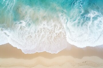 Fototapeta na wymiar Aerial view of waves crashing on a beach, perfect for travel websites or advertisements