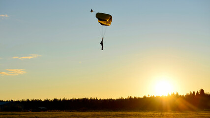skydiving with sunset in the sky