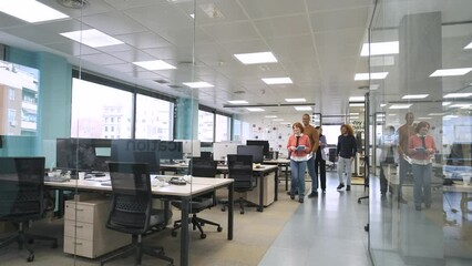 Happy diverse colleagues entering creative workspace