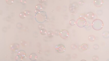 Soap bubbles on a pink background