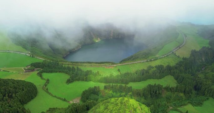 Blue and green lake Sete Cidades, Azores. Beautiful aerial footage of the lake of seven cities "Lagoa das Sete Cidades" from the Vista do Rey observation deck on the island of Sao Miguel. Portugal