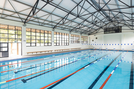 An indoor swimming pool awaits swimmers for training or leisure