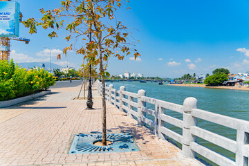 Fototapeta na wymiar The river embankment. The Kai River in Nha Trang in Vietnam. The urban landscape.
