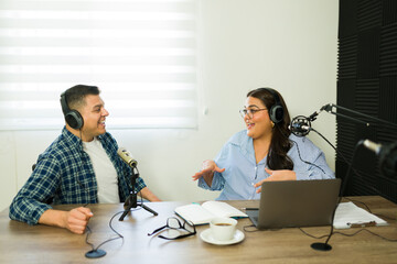Cheerful talk show host recording their podcast