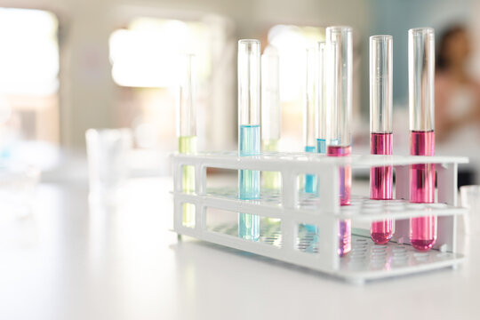 Test tubes with colorful liquids in a laboratory setting