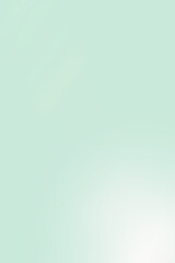 Blurred light green background with lens flare effect. Vertical, gradient. Copy space