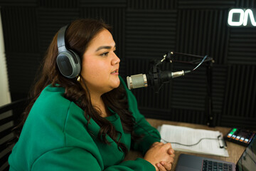 Latin woman in the recording studio for a podcast