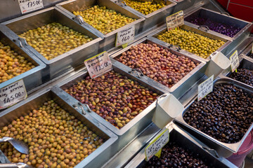 Olive shop selling green and black olives, a wide variety of pickled olive types,