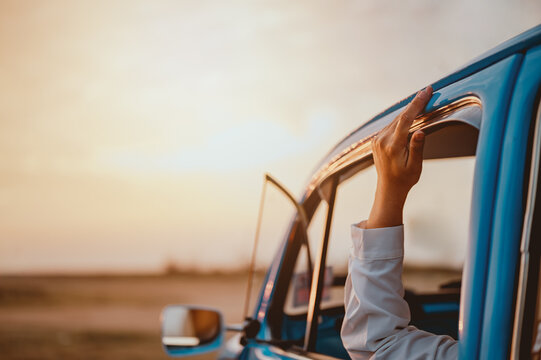 car, sunset, auto, automobile, beetle, classic, transport, transportation, sunrise, volkswagen. a volkswagen beetle in the evening sunset at grass field while the owner wave your hand in there. - Powered by Adobe