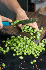 person cutting vegetables