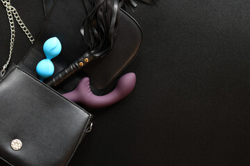 Sex toys. A small black bag with vaginal balls, a vibrator and a leather whip for intimate games....