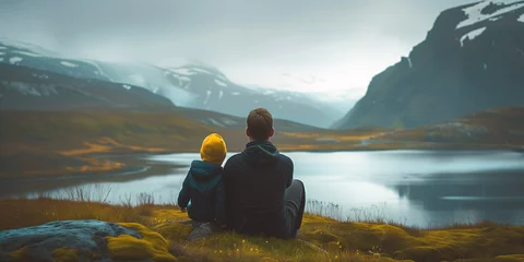Tuinposter Serene Moments. Father and Child Contemplating Mountain Lake.A peaceful scene with a father and child sitting by a misty mountain lake, immersed in nature's tranquility. © T-elle