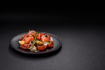 Delicious juicy salad with salmon, tomatoes, cucumber, herbs, pumpkin seeds