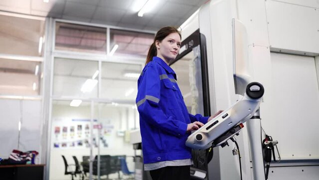 Engineers inspecting and check up machine of the automated arms machine welding robots at factory. Engineer working automatic robotic arm machine in factory. technician worker maintenance robot