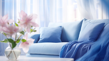Cozy Home Interior with Blue Sofa, Soft Pillows and Spring Flowers on Sunny Day