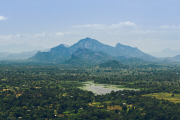 Fototapeta na wymiar Galkoth Kanda, Erawulagala, Dikkandahena mountains and Kayanwala lake view from Sigiriya rock, Sigiriya, Sri Lanka.