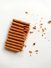 wafer roll white background. stock photo of chocolate rolled wafers