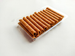 wafer roll white background. stock photo of chocolate rolled wafers
