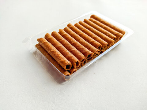 wafer roll white background. stock photo of chocolate rolled wafers