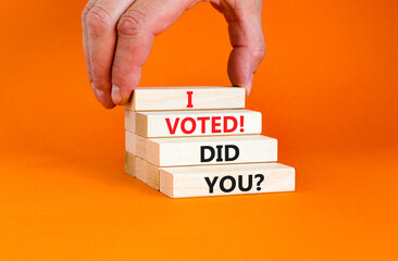 I voted. Did you symbol. Concept words I voted. Did you on beautiful wooden block. Beautiful orange table orange background. Voter hand. Business I voted. Did you concept. Copy space.