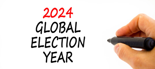 2024 global election year symbol. Concept words 2024 global election year on beautiful white paper. Beautiful white background. Voter hand. Business 2024 global election year concept. Copy space