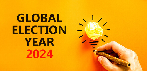 Global election year 2024 symbol. Concept words Global election year 2024 on beautiful orange...