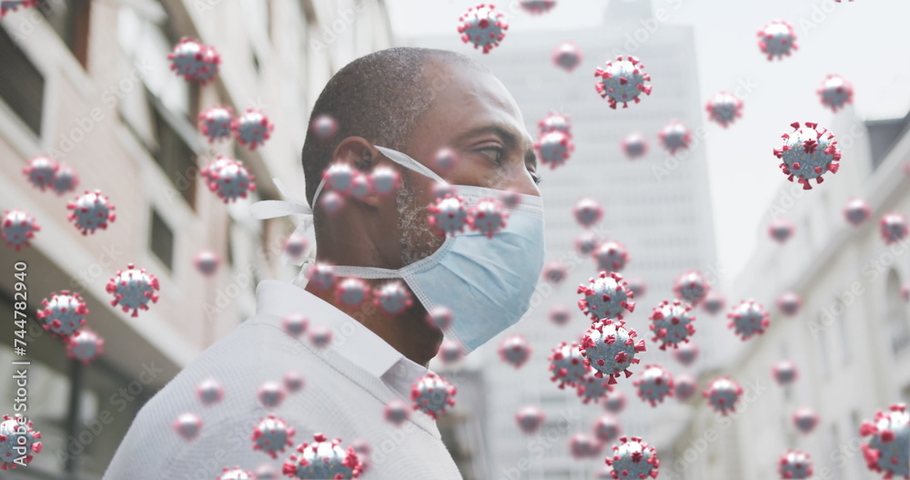 Poster Image of covid 19 cells over african american man wearing face mask