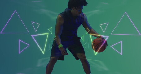 Image of neon pattern over african american basketball player