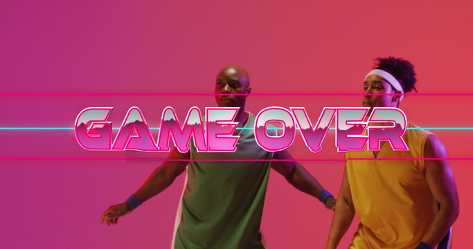 Image of game over text over neon pattern and divers basketball players
