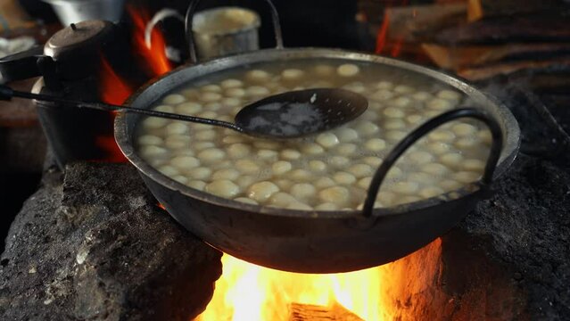 Art of making Rasgulla, a delightful Indian dessert made from milk solids, deep-fried to golden perfection and soaked in fragrant sugar syrup. Vibrant, aromatic, tempting. A feast for the senses