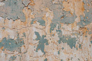 Old plastered wall with peeling paint