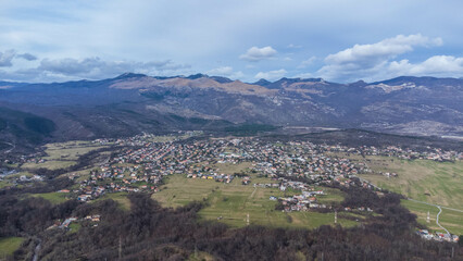 Aerial view of the charming village of Grobnik near Rijeka, Croatia, showcasing an old fortress atop a hill and a quaint church