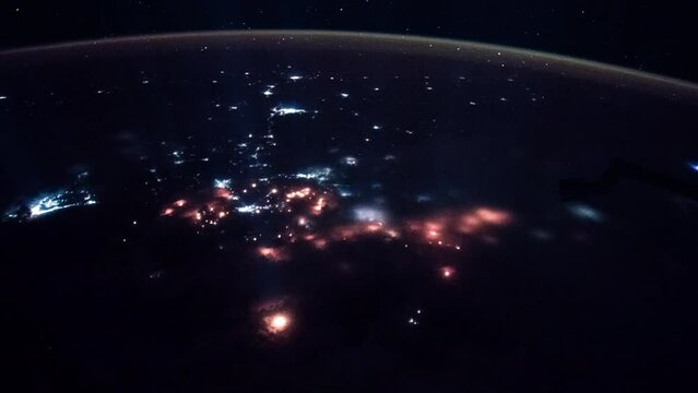 Planet Earth at night seen from space in real time. Glowing cities illumination of Earth. View from International Space Station. Public Domain images from Nasa	
