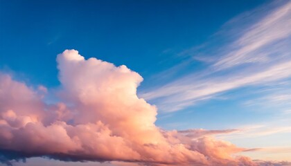 Naklejka na ściany i meble blue sky background with pale pink clouds at sunset