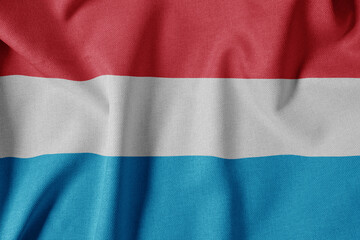 National Flag on Textured Fabric Background. Silk textured flag, realistic wave and flag look. LU  Flag of Luxembourg