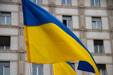 Fotobehang Ukrainian blue and yellow flag as symbol of peace and war in the same time,on the streets of Belgrade © Miros
