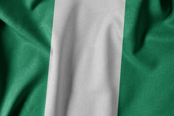 National Flag on Textured Fabric Background. Silk textured flag, realistic wave and flag look. NG  Flag of Nigeria