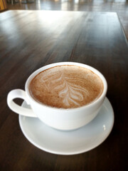 cappuccino with cinnamon in a cup on the table
