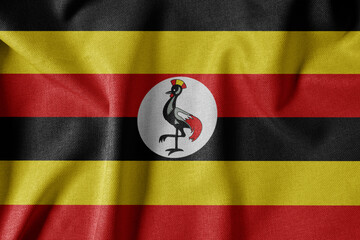 National Flag on Textured Fabric Background. Silk textured flag, realistic wave and flag look. UG  Flag of Uganda
