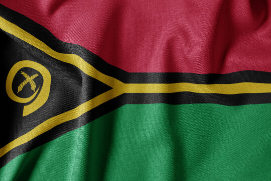 National Flag on Textured Fabric Background. Silk textured flag, realistic wave and flag look. VU  Flag of Vanuatu