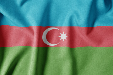 National Flag on Textured Fabric Background. Silk textured flag, realistic wave and flag look. AZ Flag of Azerbaijan