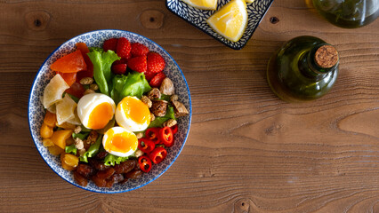 person holding a bowl of salad