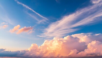 Naklejka na ściany i meble blue sky background with pale pink clouds at sunset