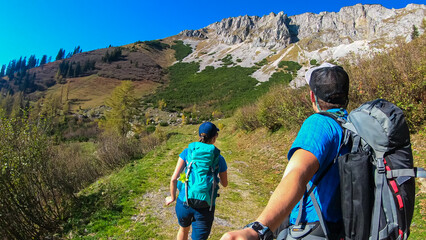 Hiker couple on hiking trail to top of mountain peak Hohe Veitsch in Mürzsteg Alps, Styria,...