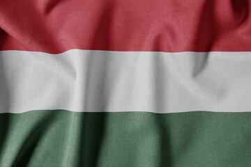 National Flag on Textured Fabric Background. Silk textured flag, realistic wave and flag look. HU  Flag of Hungary