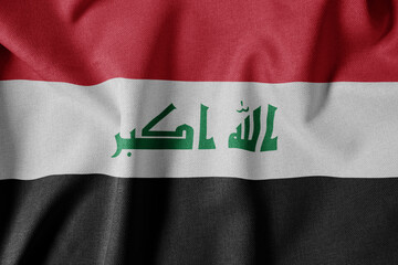 Naklejka premium National Flag on Textured Fabric Background. Silk textured flag, realistic wave and flag look. IQ Flag of Iraq