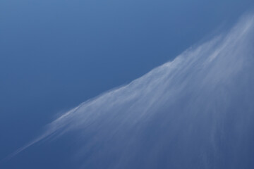 Diagonal line pattern abstract nature of white clouds and blue sky background. Cirrus clouds on...