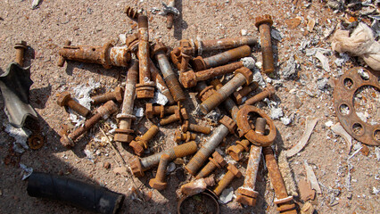 bolts and nuts scattered on the ground