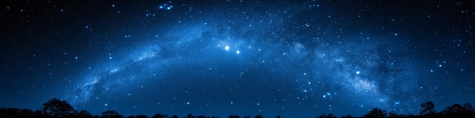 Ethereal blue night sky with a scattered star field, capturing the tranquil beauty of the cosmos